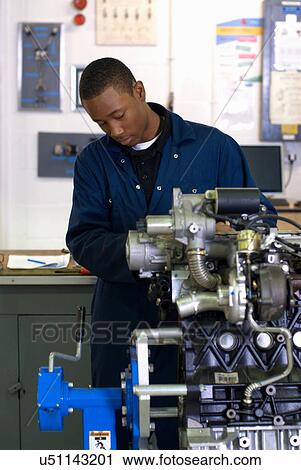 Student working on car engine View Large Photo Image Stock Image - Student working on car engine. Fotosearch