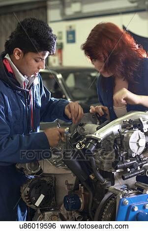 Student working on car engine View Large Photo Image Stock Photograph - Student working on car engine. Fotosearch