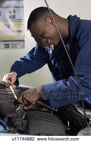 Students working on car engine View Large Photo Image Stock Image - Students working on car engine. Fotosearch