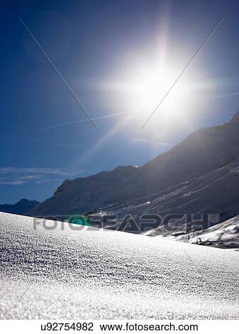 Sun shining over snowy landscape View Large Photo Image Stock Image - Sun shining over snowy landscape. Fotosearch