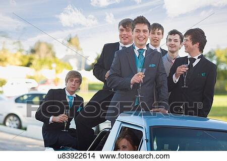 Teenage boys in suits smiling from car View Large Photo Image Picture - Teenage boys in suits smiling from car. Fotosearch