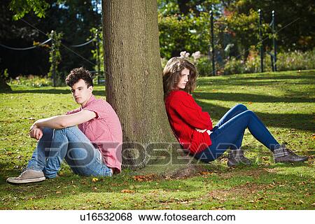 Teenage couple arguing in park View Large Photo Image Stock Photo - Teenage couple arguing in park. Fotosearch