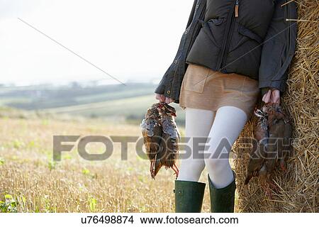 Teenage girl carrying game birds View Large Photo Image Picture - Teenage girl carrying game birds. Fotosearch