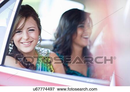 Stock Photo - Teenage girl in gown sitting in car. Fotosearch