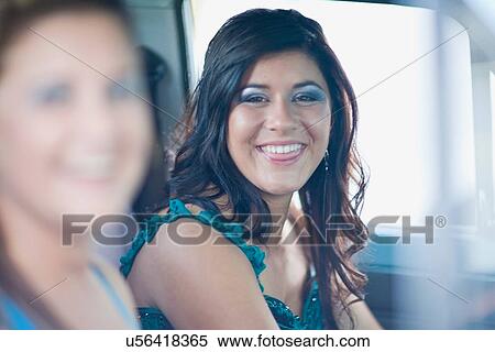 Teenage girl in gown smiling in car View Large Photo Image Stock Photography - Teenage girl in gown smiling in car. Fotosearch