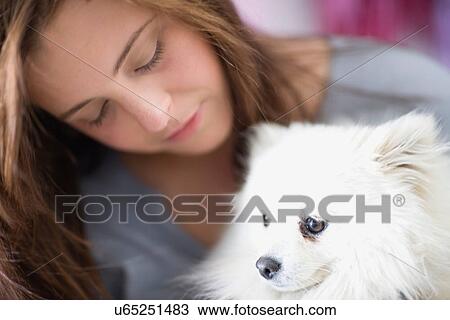 Teenage girl petting dog View Large Photo Image Stock Image - Teenage girl petting dog. Fotosearch