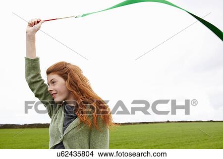 Teenage girl playing with ribbon View Large Photo Image Picture - Teenage girl playing with ribbon. Fotosearch