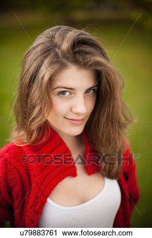 Teenage girl smiling in park View Large Photo Image Stock Image - Teenage girl smiling in park. Fotosearch