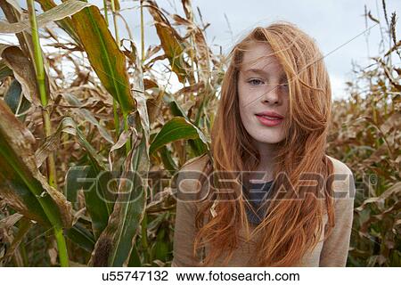 Teenage girl walking in cornfield View Large Photo Image Stock Image - Teenage girl walking in cornfield. Fotosearch