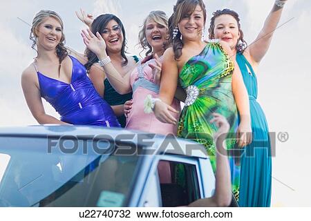Teenage girls in gowns waving from car View Large Photo Image Stock Image - Teenage girls in gowns waving from car. Fotosearch