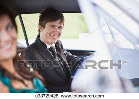 Teenagers driving car in formal wear View Large Photo Image Stock Photo - Teenagers driving car in formal wear. Fotosearch