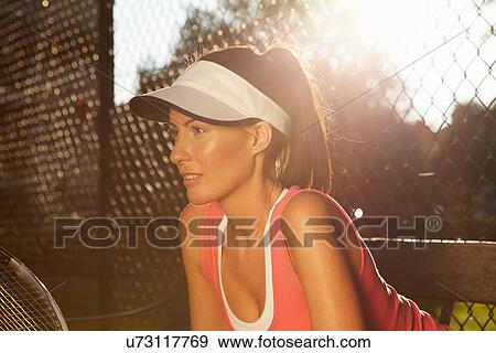 Tennis player poised on court View Large Photo Image Stock Photo - Tennis player poised on court. Fotosearch