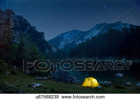 Stock Photo - Time lapse of campsite and night sky. Fotosearch