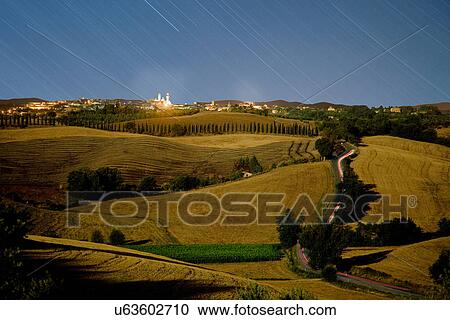 Time lapse of rural hills and night sky View Large Photo Image Stock Image - Time lapse of rural hills and night sky. Fotosearch