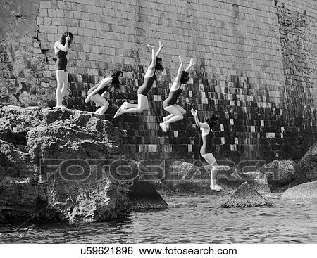 Time lapse of woman jumping onto beach View Large Photo Image Stock Photograph - Time lapse of woman jumping onto beach. Fotosearch