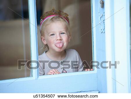 Toddler girl in tiara making a face View Large Photo Image Stock Photo - Toddler girl in tiara making a face. Fotosearch