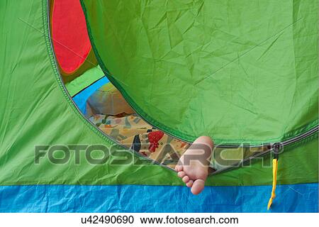Toddler's foot sticking out of tent View Large Photo Image Stock Image - Toddler's foot sticking out of tent. Fotosearch