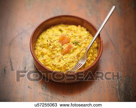 Stock Image - Traditional dish of scrambled egg and Scottish smoked salmon. Fotosearch