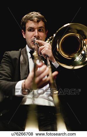 Stock Photo - Trombone player in orchestra. Fotosearch