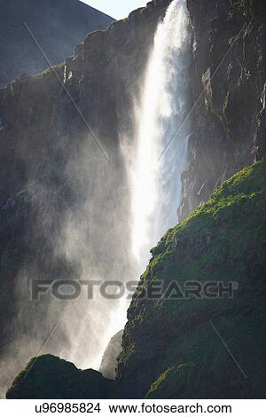 Waterfall over steep rock wall View Large Photo Image Picture - Waterfall over steep rock wall. Fotosearch