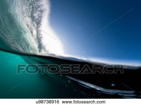 Stock Photograph - Wave crashing on water. Fotosearch