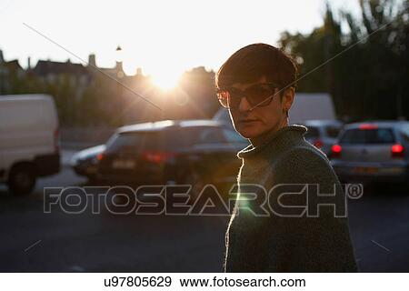 Woman crossing city street View Large Photo Image Stock Photo - Woman crossing city street. Fotosearch