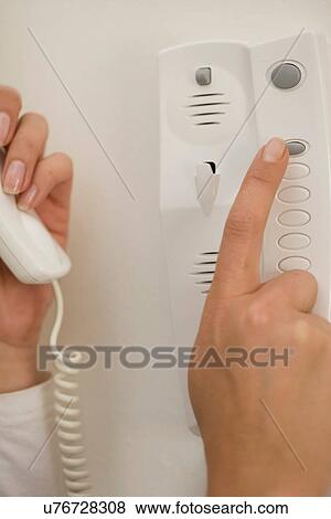 Woman dialing telephone View Large Photo Image Stock Photo - Woman dialing telephone. Fotosearch