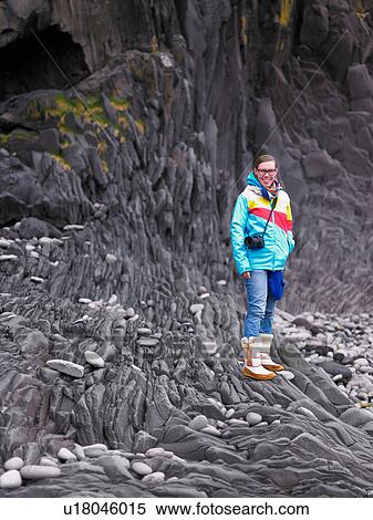 Woman exploring rock formations View Large Photo Image Stock Photography - Woman exploring rock formations. Fotosearch
