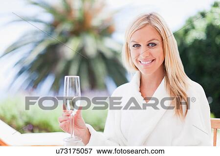 Woman in bathrobe relaxing outdoors View Large Photo Image Stock Photo - Woman in bathrobe relaxing outdoors. Fotosearch