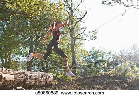 Woman running in park View Large Photo Image Stock Photo - Woman running in park. Fotosearch