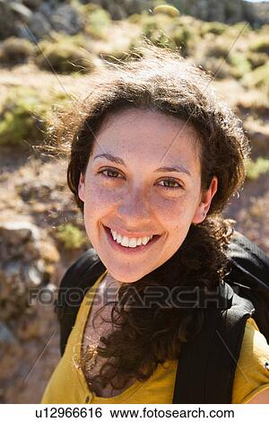 Stock Photograph - Woman smiling outdoors. Fotosearch
