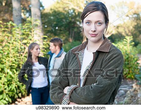 Woman standing in park View Large Photo Image Stock Image - Woman standing in park. Fotosearch