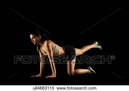 Stock Photography - Woman stretching legs. Fotosearch