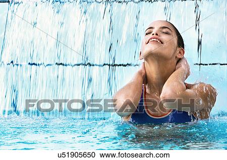 Woman swimming in indoor pool View Large Photo Image Stock Image - Woman swimming in indoor pool. Fotosearch