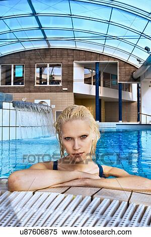 Woman swimming in indoor pool View Large Photo Image Stock Photography - Woman swimming in indoor pool. Fotosearch