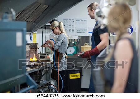 Woman using blowtorch in creative studio View Large Photo Image Stock Photography - Woman using blowtorch in creative studio. Fotosearch