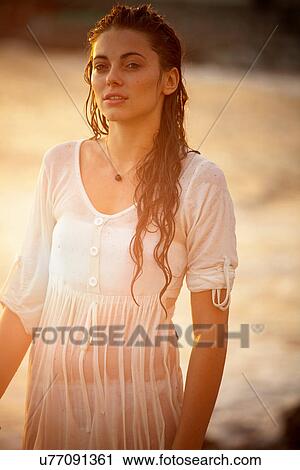 Woman walking on beach View Large Photo Image Stock Image - Woman walking on beach. Fotosearch