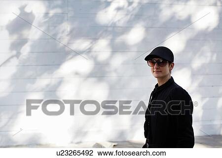 Stock Image - Woman walking outdoors. Fotosearch