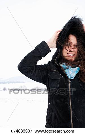 Woman wearing parka in snow View Large Photo Image Stock Photo - Woman wearing parka in snow. Fotosearch