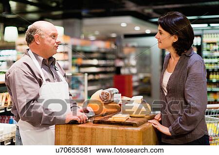 Woman with free samples in grocery store View Large Photo Image Stock Image - Woman with free samples in grocery store. Fotosearch