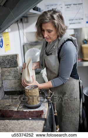 Woman working on art project View Large Photo Image Stock Image - Woman working on art project. Fotosearch