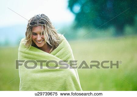 Woman wrapped in blanket outdoors View Large Photo Image Stock Photography - Woman wrapped in blanket outdoors. Fotosearch