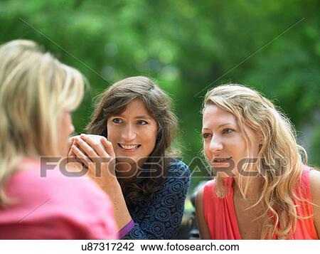 Women having coffee at sidewalk cafe View Large Photo Image Stock Image - Women having coffee at sidewalk cafe. Fotosearch