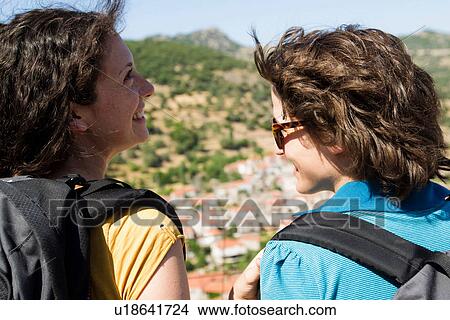 Women overlooking landscape from hill View Large Photo Image Picture - Women overlooking landscape from hill. Fotosearch