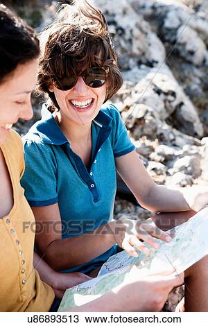 Women reading map outdoors View Large Photo Image Stock Image - Women reading map outdoors. Fotosearch