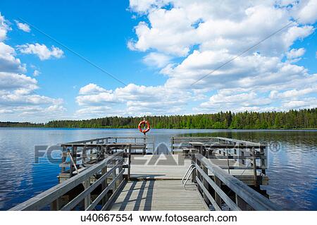 Picture - Wooden dock in rural lake. Fotosearch