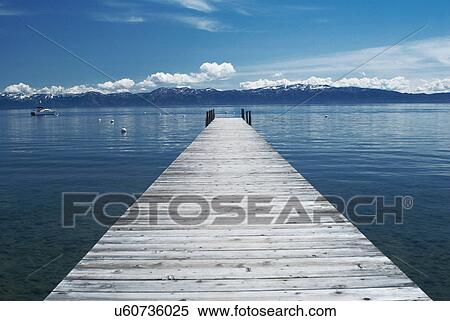 Stock Photography - Wooden dock in still lake. Fotosearch