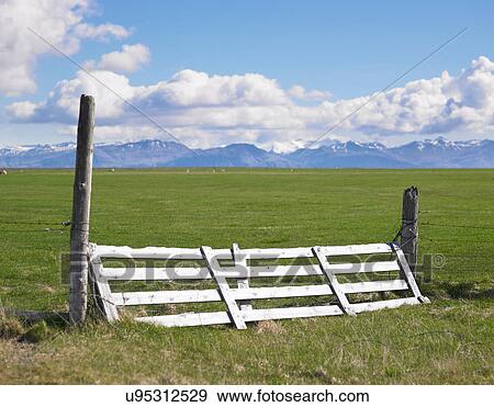 Wooden fence in rural field View Large Photo Image Stock Photo - Wooden fence in rural field. Fotosearch