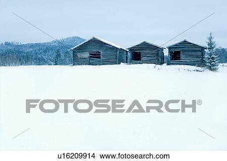 Wooden houses in snowy field View Large Photo Image Picture - Wooden houses in snowy field. Fotosearch