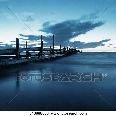 Stock Photograph - Wooden pier over ocean. Fotosearch